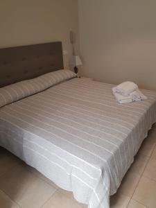 A bed or beds in a room at HOTEL CONDOR
