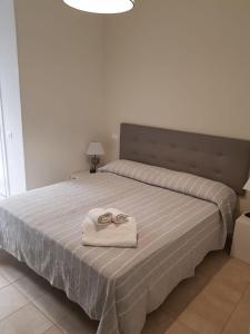 A bed or beds in a room at HOTEL CONDOR