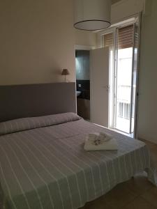 A bed or beds in a room at HOTEL CONDOR