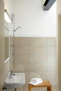 a bathroom with a sink and a shower at Hotel Villa8 in Villingen-Schwenningen