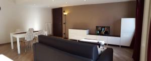 a living room with a couch and a table at Palmira Guest House in Aosta