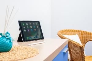 a laptop computer sitting on top of a table at Residence Due Torri in Maiori
