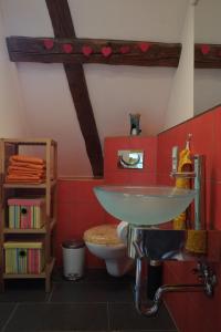 a bathroom with a sink and a toilet at Studio in der alten Scheune in Eschbach