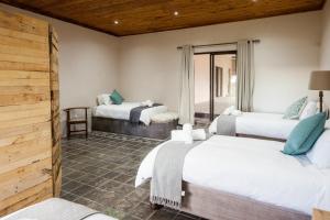 Postel nebo postele na pokoji v ubytování Witfontein Game Lodge