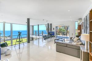 a living room with a view of the ocean at Villa Bay Blue by PriorityVillas in Badia Blava