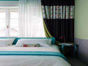 A bed or beds in a room at PratinnVatican