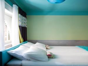 A bed or beds in a room at PratinnVatican