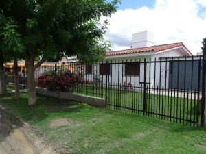 a black fence in front of a house at susana in La Falda