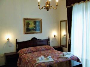 En eller flere senge i et værelse på Casa Cipriani