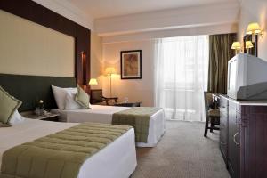 Postel nebo postele na pokoji v ubytování Safir Hotel Cairo