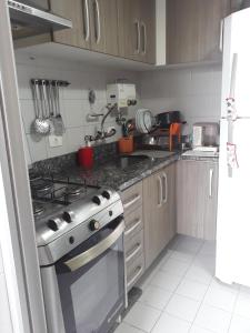 Кухня или кухненски бокс в Apartamento 2 quartos aconchegante