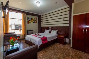 Postelja oz. postelje v sobi nastanitve Hotel Suite Naylamp Zyon