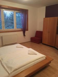 Postel nebo postele na pokoji v ubytování Holiday Park Vrchlabí - Liščí farma