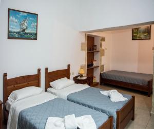 מיטה או מיטות בחדר ב-Villa Dimitris