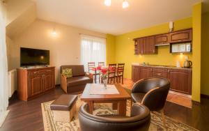 Telewizja i/lub zestaw kina domowego w obiekcie Janówka Apartamenty