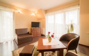 Telewizja i/lub zestaw kina domowego w obiekcie Janówka Apartamenty