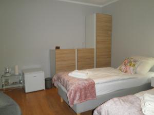Postel nebo postele na pokoji v ubytování Apartament Esja