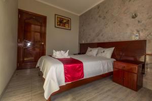 Postelja oz. postelje v sobi nastanitve Hotel Suite Naylamp Zyon