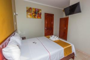Postelja oz. postelje v sobi nastanitve Hotel Suite Naylamp Zyon