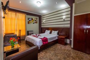 Postelja oz. postelje v sobi nastanitve Hotel Suite Naylamp Zyon