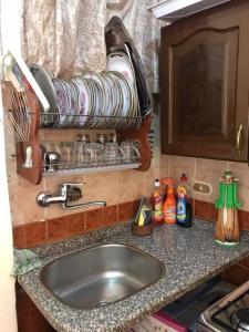 a kitchen counter top with a sink and a sink at Cozy new 2 BD Amazing beach view Next to Hilton hotel Family only !العائلات فقط in Alexandria