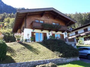 a house with a car parked in front of it at Haus Hauser in Lofer