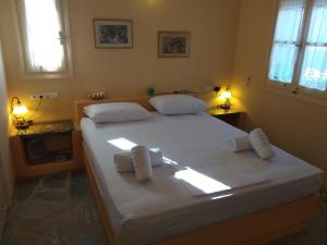 Ένα ή περισσότερα κρεβάτια σε δωμάτιο στο Despotiko View