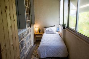 Ένα ή περισσότερα κρεβάτια σε δωμάτιο στο Berenice Winery Suites