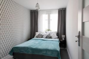 Posteľ alebo postele v izbe v ubytovaní Legnica Apartament 52m2 Delux 1