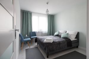 Posteľ alebo postele v izbe v ubytovaní Legnica Apartament 52m2 Delux 1