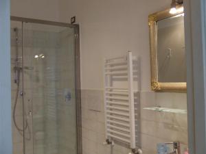 a bathroom with a shower and a mirror at Casa Cipriani in Potenza Picena