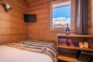 Val Thorens-Cosy Appartement avec vue Vanoise 566にあるベッド