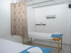 Ένα ή περισσότερα κρεβάτια σε δωμάτιο στο Hostal Sueños