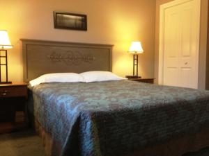 Cama o camas de una habitación en McIntyre's Cottages