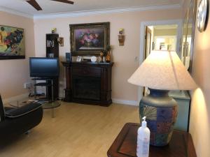 a living room with a lamp on a table at Cozy Bedrooms Guest House in Vancouver