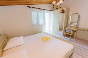 Posteľ alebo postele v izbe v ubytovaní Apartments Jere Proto
