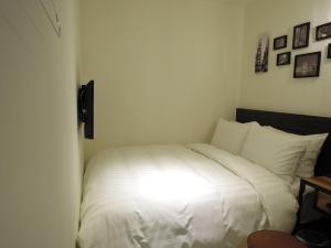 Postel nebo postele na pokoji v ubytování Re-Change Hotel Taipei