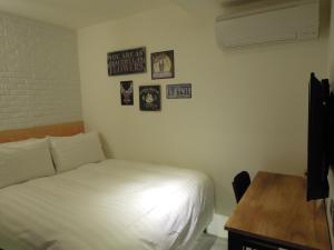 Postel nebo postele na pokoji v ubytování Re-Change Hotel Taipei