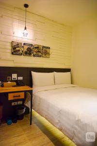 Postel nebo postele na pokoji v ubytování Re-Change Hotel Taipei