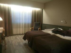 Cama o camas de una habitación en Hotelli Kivitippu