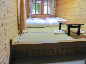 Postel nebo postele na pokoji v ubytování Kizuna Lodge & BBQ Centre
