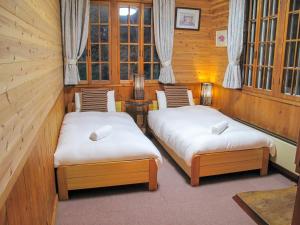 Postel nebo postele na pokoji v ubytování Kizuna Lodge & BBQ Centre