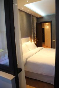 Postel nebo postele na pokoji v ubytování Super Luxury Apartments