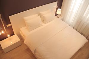 Postel nebo postele na pokoji v ubytování Super Luxury Apartments