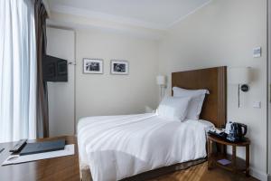 Postel nebo postele na pokoji v ubytování Warwick Geneva