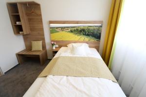 Postel nebo postele na pokoji v ubytování Hotel Wiehen-Therme