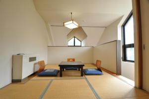 Postel nebo postele na pokoji v ubytování Hakuba Yamano Hotel