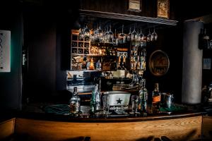 a bar with a lot of bottles of alcohol at Havana Hotel Cairo in Cairo