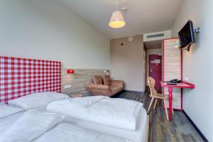 Posteľ alebo postele v izbe v ubytovaní MEININGER Hotel Salzburg City Center