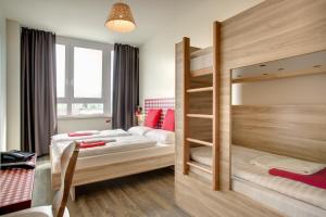 Posteľ alebo postele v izbe v ubytovaní MEININGER Hotel Salzburg City Center